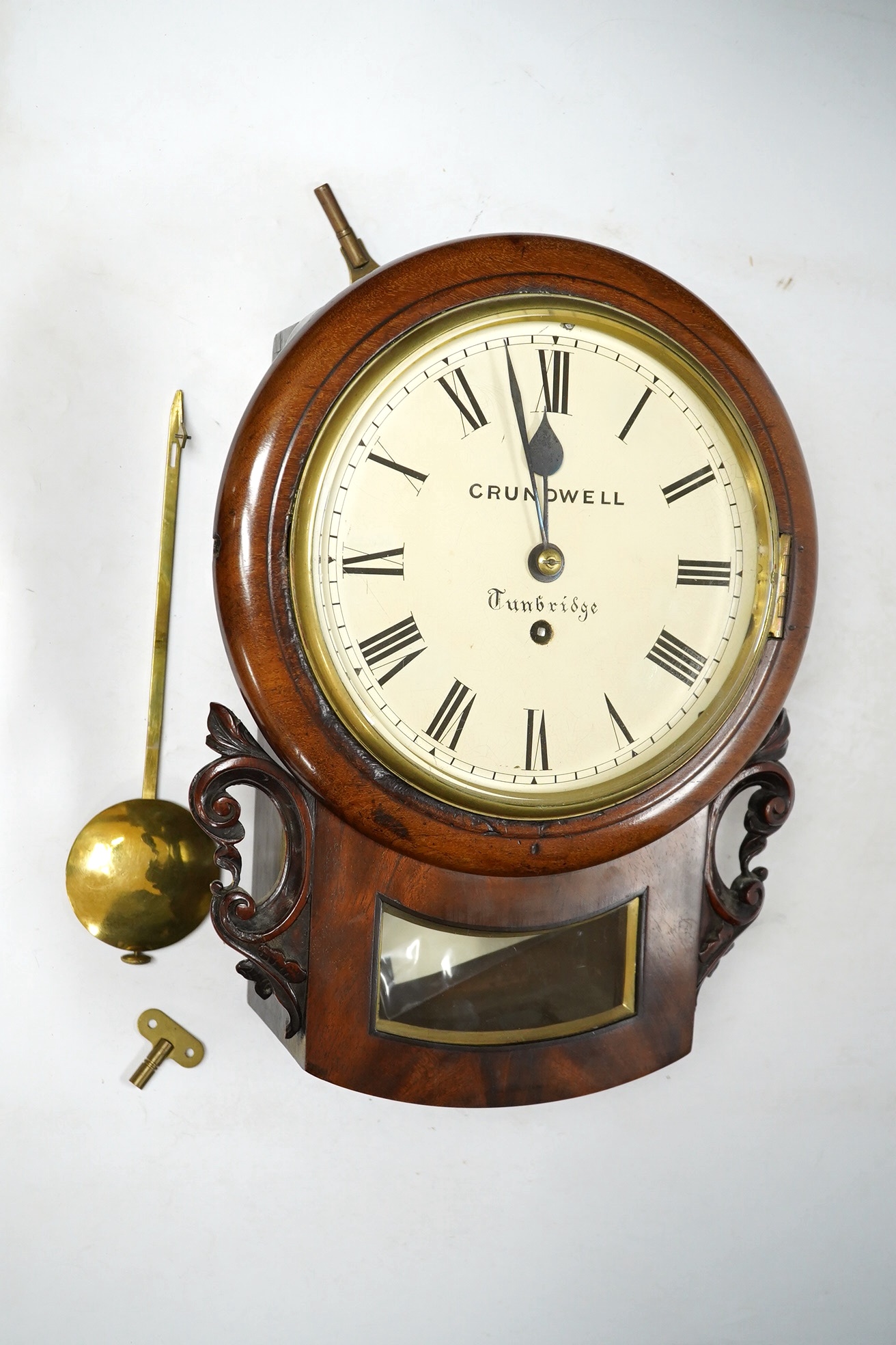 A mid 19th century small mahogany cased drop dial wall clock by Crundwell of Tunbridge, with key and pendulum, 37cm high. Condition - fair to good. Not tested as working